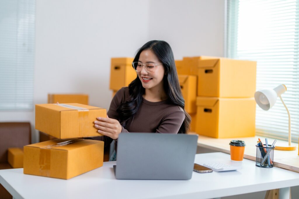 Woman organizing packages for her e-commerce startup
