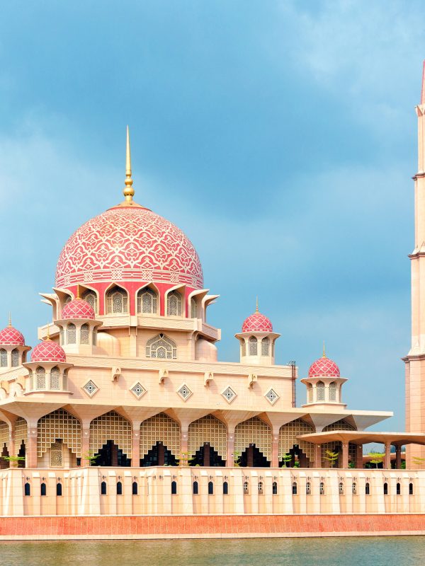 General view of the Putra Mosque with Putrajaya Lake, dramatic sky. Malaysia, Cyberjaya